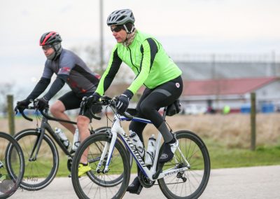 Bright green cycling jacket on male cyclist during Bluebonnet Express bike event.