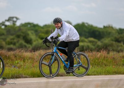 Bike rider on Bluebonnet Express bike trail in Texas, promoting cycling and outdoor recreation.