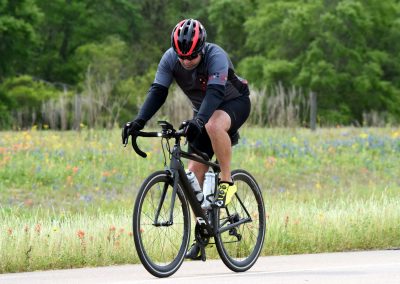 Enhanced cycling journey with the Bluebonnet Express e-bike in scenic outdoor landscapes.
