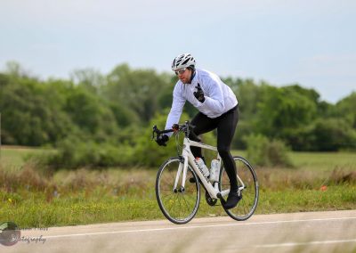 Smooth cycling on scenic Texas countryside with Bluebonnet Express bike.