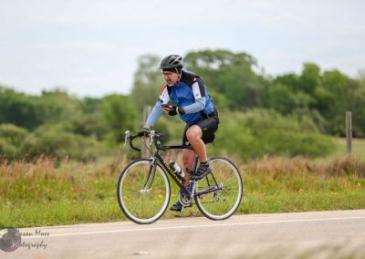 Brightman Bluebonnet Express cycling event, rider enjoying scenic Texas countryside ride.