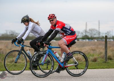 Bike ride with cyclists on Bluebonnet Express route, showcasing cycling events and scenic Texas landscapes.