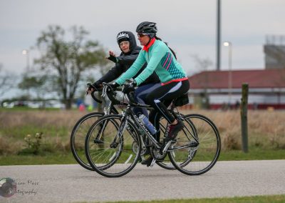 Busy cyclists enjoying a ride along a scenic route, promoting active lifestyles and outdoor recreation.