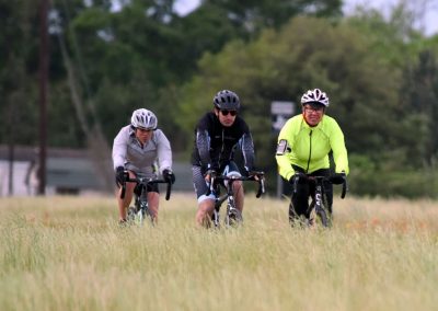 Family cycling tour on the Bluebonnet Express trail in Texas, enjoying scenic outdoor adventure.
