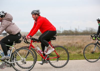 Cyclists riding bikes outdoors during daytime.