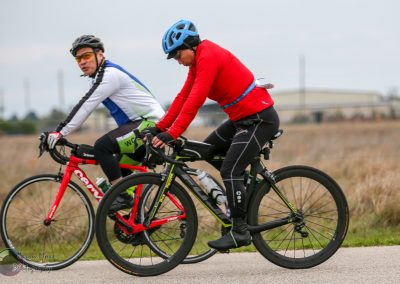 Fast-paced cycling on Bluebonnet Express trail, featuring seasoned cyclists enjoying scenic outdoor biking.