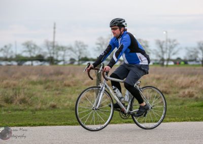 Bicycle rider on Bluebonnet Express cycling route, enjoying outdoor adventure and scenic views in Texas.