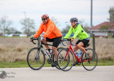 Highway cycling with a man and girl on bikes in outdoor park, Bluebonnet Express, Texas.