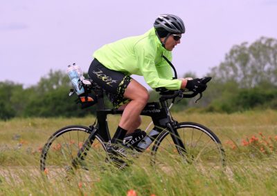 High-performance electric bike in a scenic outdoor setting, showcasing Bluebonnet Express for eco-friendly cycling.