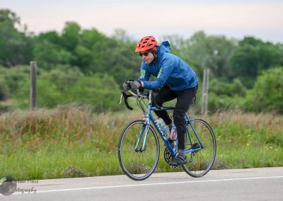 Bike rider on Bluebonnet Express cycling route in Texas, scenic outdoor landscape.