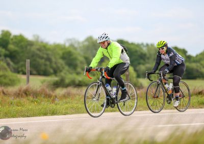 Bike tourism with Bluebonnet Express, cyclists riding scenic Texas countryside, outdoor adventure, cycling, eco-friendly travel.