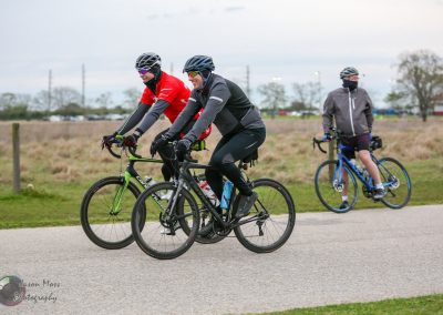 St. Louis cyclists riding on a bike path, promoting Bluebonnet Express bike community event.