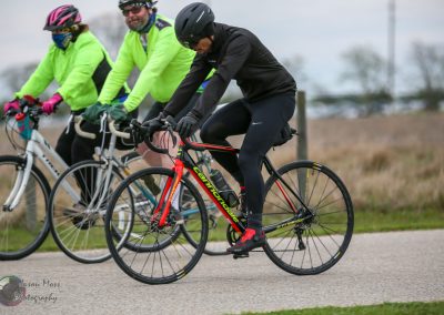 High-performance cycling team riding professional bikes outdoors for sport and fitness.