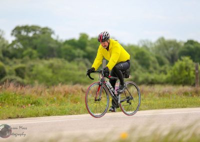 Vibrant bluebonnet flowers bloom along a scenic Texas bike trail, highlighting the beauty of outdoor cycling adventures.