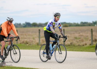 Bike riding group on scenic rural trail for Bluebonnet Express cycling event.