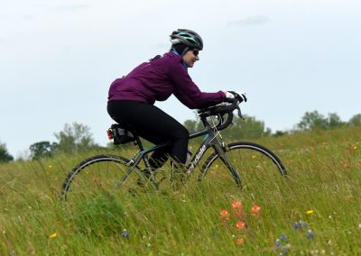 Colorful outdoor cyclist on a scenic trail during daytime.