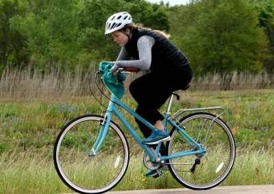 Relaxing outdoor bike ride through scenic nature trail, enjoying eco-friendly transportation.