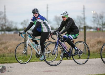 Smooth ride with Bluebonnet Express cycling team on scenic outdoor trail.