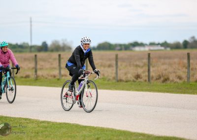 Comfortable cycling on Bluebonnet Express bike trail with scenic Texas countryside.