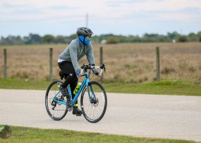 Brightblue road bicycle in sport outdoor ride, cyclist enjoying scenic pathway.