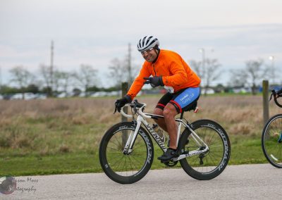 Vibrant cyclist participating in Bluebonnet Express cycling event on day of race.