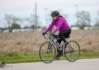 Women cycling on bike during daytime outdoors.