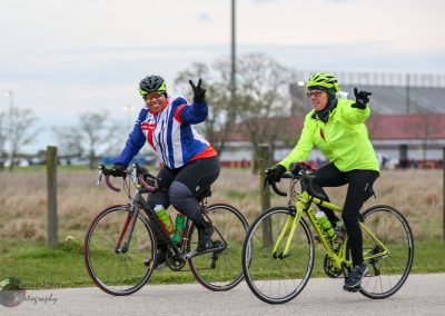 Vibrant cyclists riding together during Bluebonnet Express event, showcasing outdoor adventure and cycling fitness.