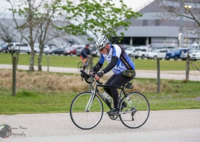 Bike rider in Bluebonnet Express cycling event, focused on performance and health.