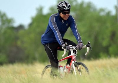 Smoothie bicycle ride on a scenic trail with cyclist in biking gear.