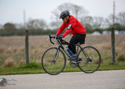 High-performance cyclist riding a Scott road bike outdoors for fitness or commuting.