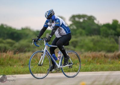 High-performance blue and white road bike used for Bluebonnet Express cycling event.