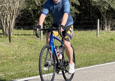 Bike rider on Bluebonnet Express cycling route, enjoying Texas scenic outdoors.