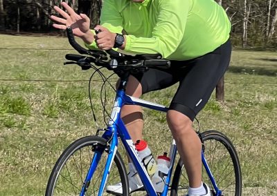 Vibrant cyclist on Bluebonnet Express bike ride, enjoying outdoor Texas trail biking adventure.