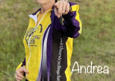 Smiling woman in cycling gear pointing outdoors, promoting Bluebonnet Express cycling club.