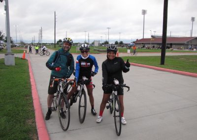 Bicycle riders enjoying the Bluebonnet Express cycling event on a cloudy day.