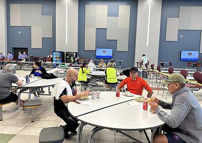 Refreshing indoor dining area at Bluebonnet Express with travelers enjoying meals.