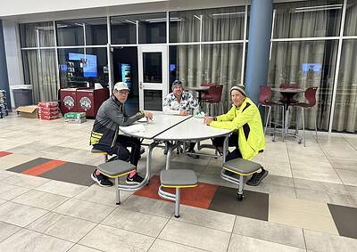 Cycling enthusiasts enjoying a break at Bluebonnet Express, a top-rated bicycle-friendly café for cyclists.