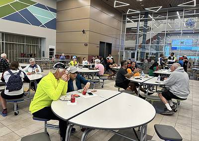 Comfortable indoor dining area at Bluebonnet Express for travelers and cyclists.