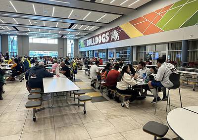 Bright indoor dining area at Bluebonnet Express, a popular rest stop for travelers and cyclists.
