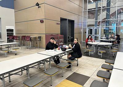 Modern indoor dining area at Bluebonnet Express, a popular spot for travelers and students.