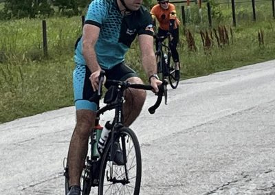 Cyclists riding on a rural road during a Bluebonnet Express cycling event.