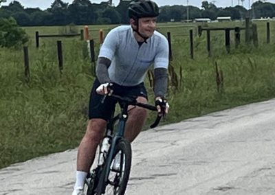Smooth gravel road cycling with a cyclist enjoying outdoor adventure in rural Texas.