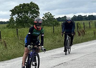 Bright bluebonnet-themed cycling jerseys for outdoor biking in scenic countryside.