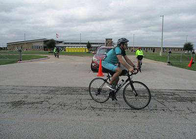 Bicycle rider participating in Bluebonnet Express charity cycling event in Texas.