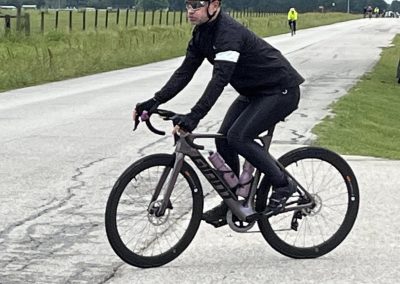 Lightweight gravel bike on scenic rural trail during daytime.