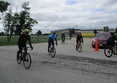 Cyclists riding during Bluebonnet Express event on a cloudy day in Texas.
