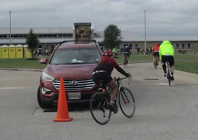 Cyclists participating in Bluebonnet Express cycling event on a cloudy day.