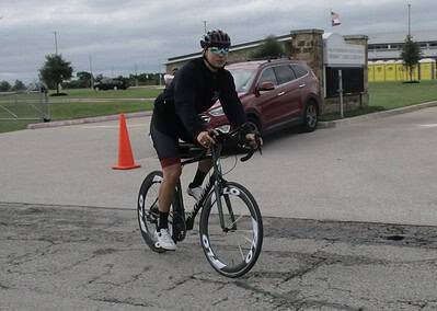 Bike rider participating in Bluebonnet Express cycling event on a cloudy day.