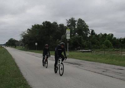 Energized cyclists riding on the rural bike trail near Bluebonnet Express.