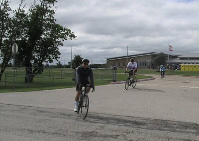 Cyclists riding during Bluebonnet Express outdoor cycling event, Texas, in cloudy weather.